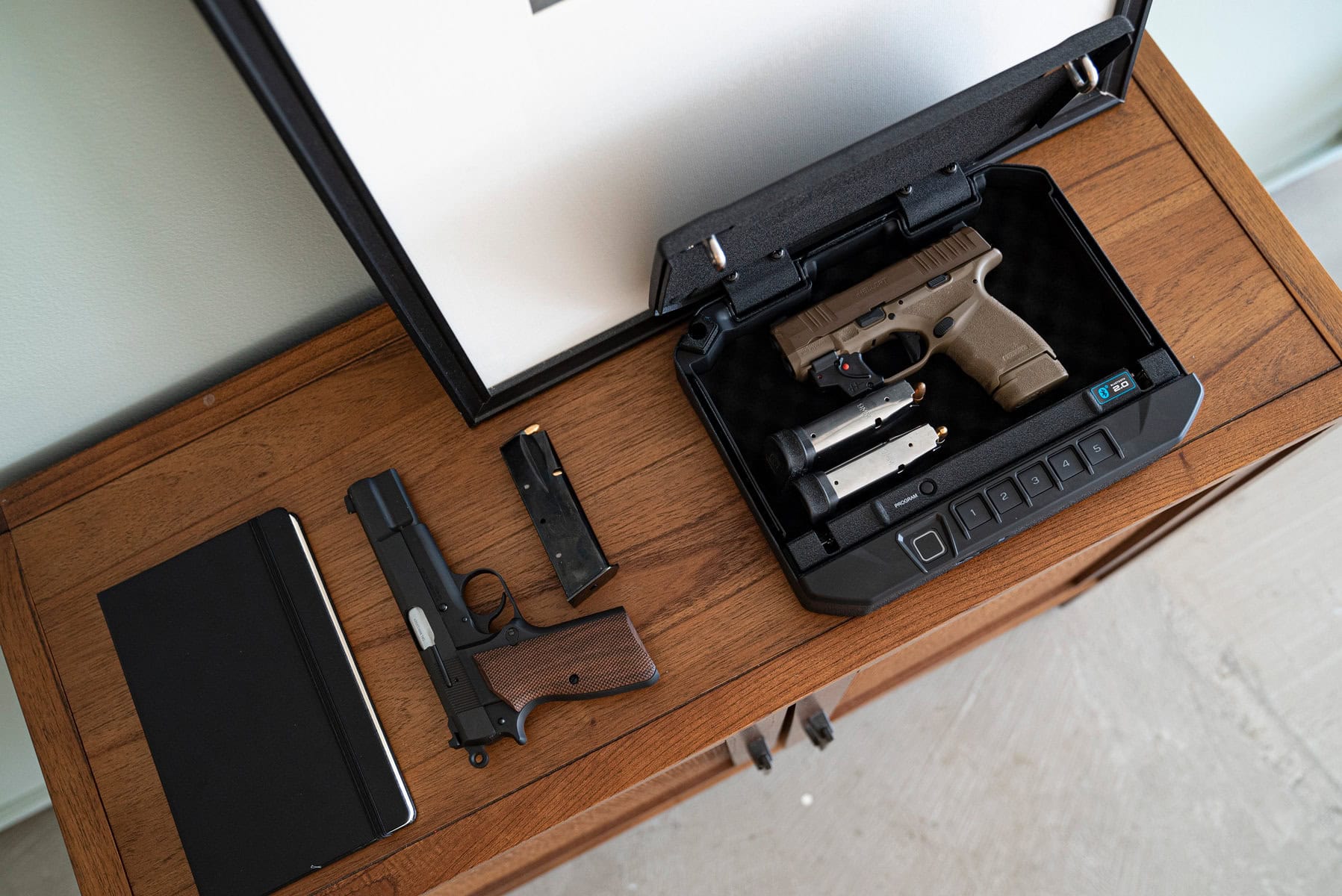 Compact secure storage and shooting accessories on a work surface